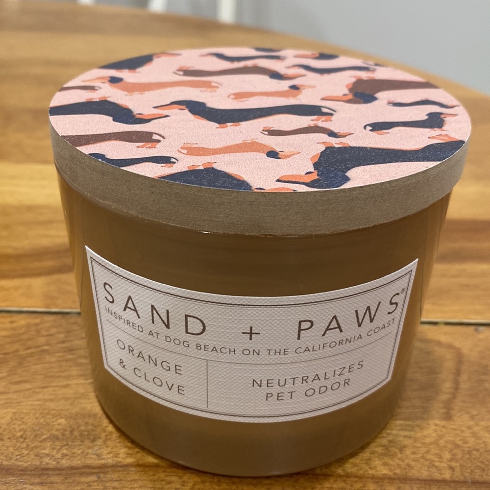NWOT.  Sand + Paws, 12 oz., 2-wick jar candle with lid.
